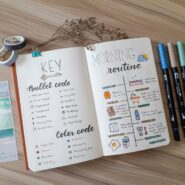 an open book with writing on it next to a pair of scissors